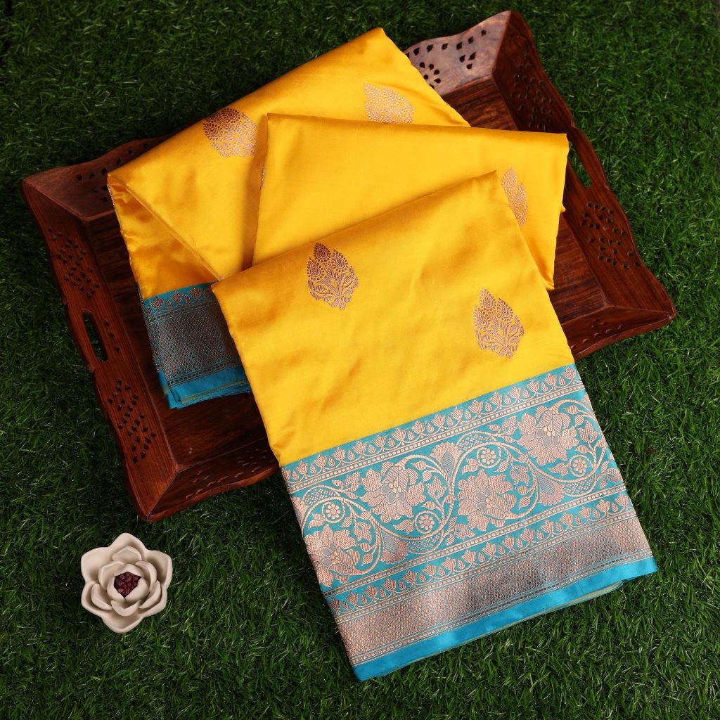 Bright Yellow Banarasi silk saree with a striking sea blue border