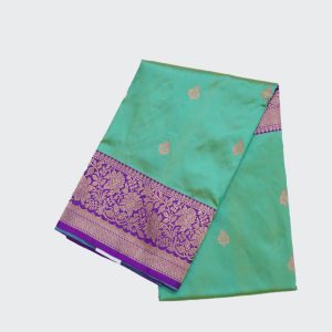 Aqua Blue Banaras Pattu Saree Highlighted with Golden Zari Floral Design and a Purple Pallu