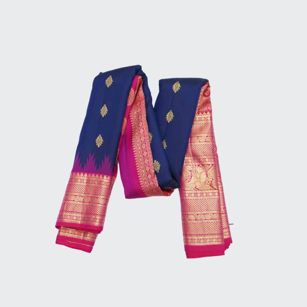Indigo Blue Gadwal Pattu Saree with a contrasting pink border featuring golden zari