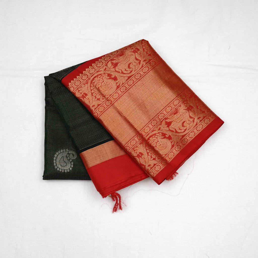 Charcoal black Kuppadam pattu saree with rich silk texture, fine weave details, and subtle sheen showcasing traditional craftsmanship