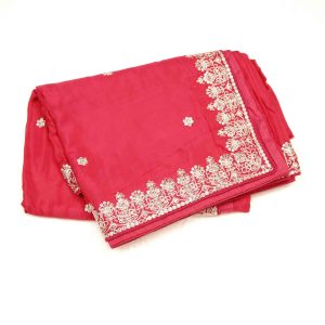 Deep red designer saree with intricate thread embroidery, sequin embellishments, and rich fabric showcasing detailed handcrafted work