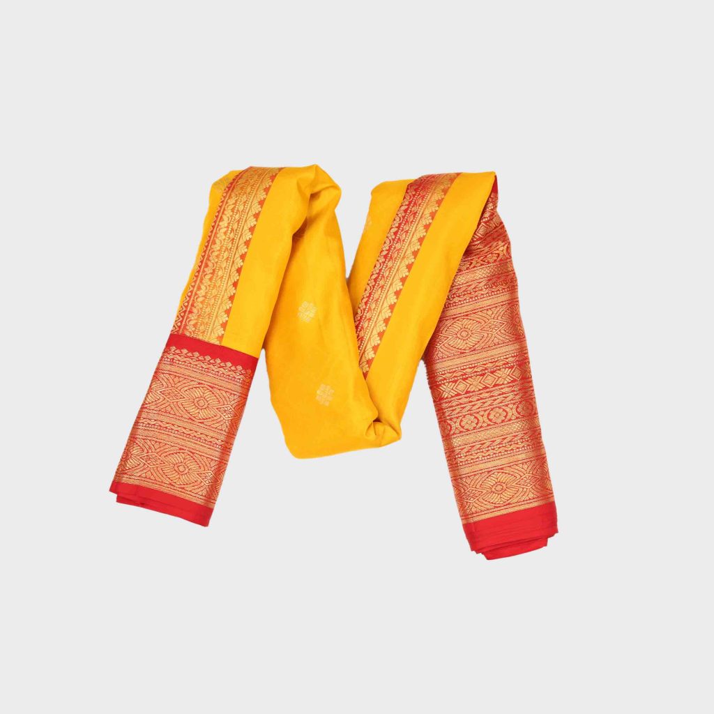 Golden yellow Gadwal pattu saree with traditional handloom silk weaving patterns and rich golden color showing premium quality craftsmanship