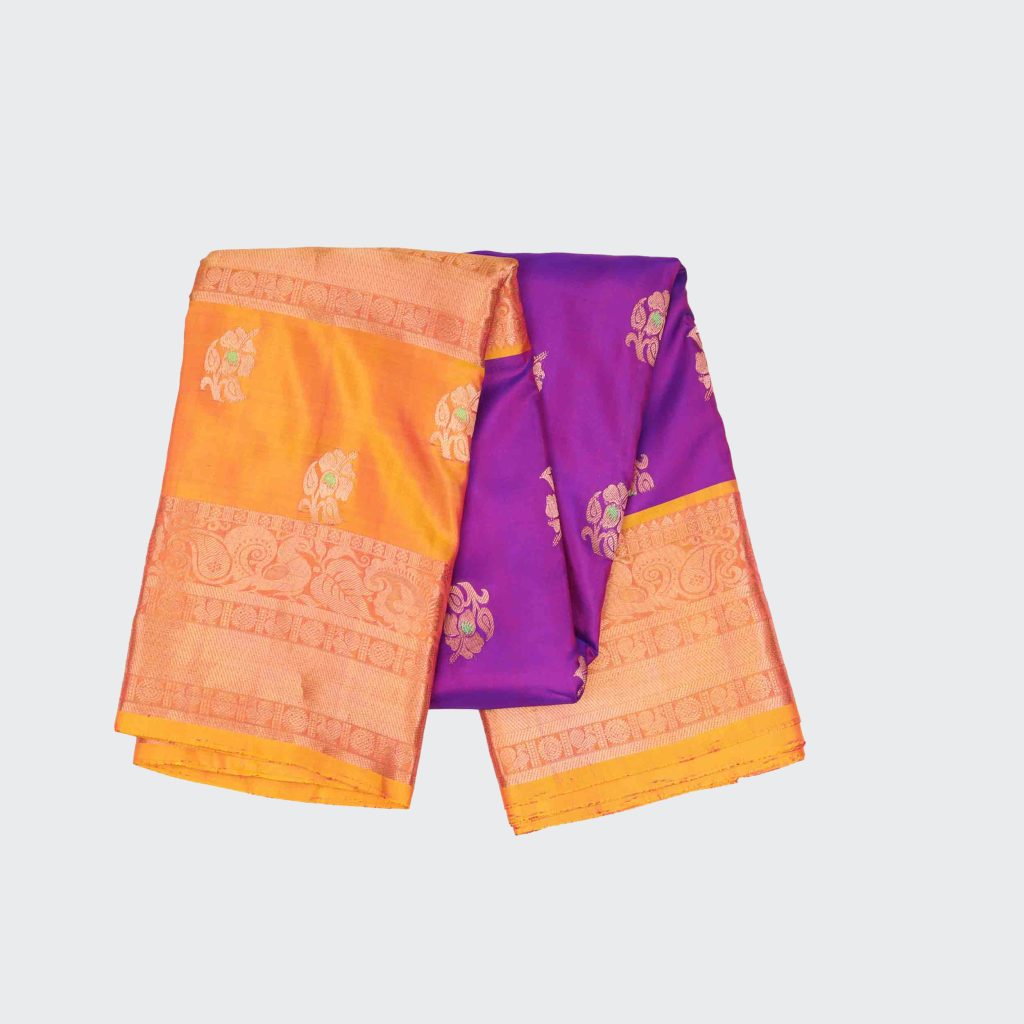 Magenta pink silk saree with distinctive gap border details in contrasting hues, highlighting traditional Kanchipuram weave and glossy silk finish