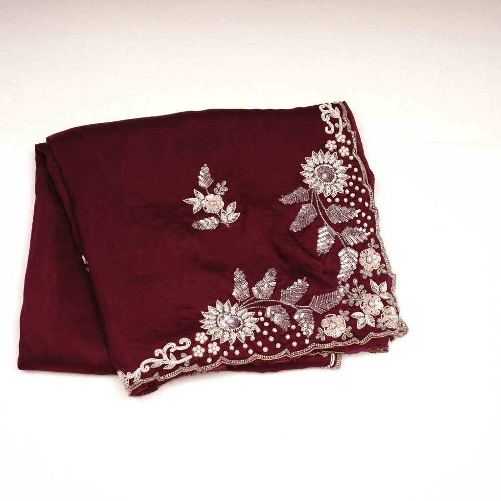 Beautiful maroon and brown colored saree with fancy work perfect for weddings and festive occasions