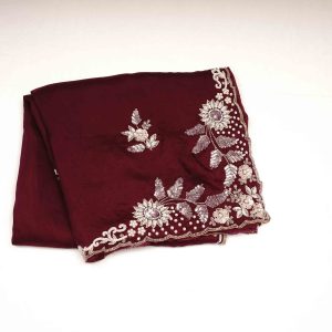 Beautiful maroon and brown colored saree with fancy work perfect for weddings and festive occasions