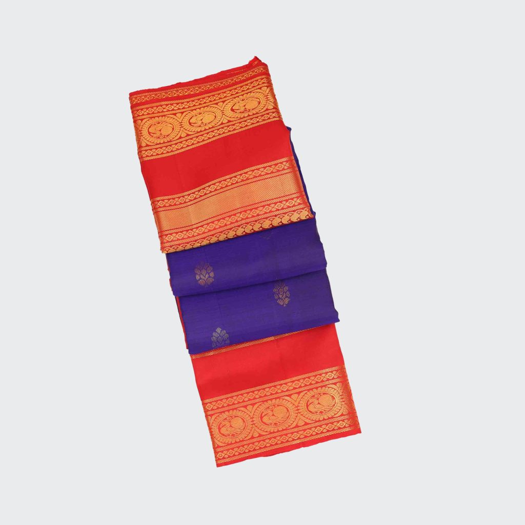 Navy blue silk saree with traditional Kanchipuram gap border design, highlighting rich color contrast and detailed handloom craftsmanship