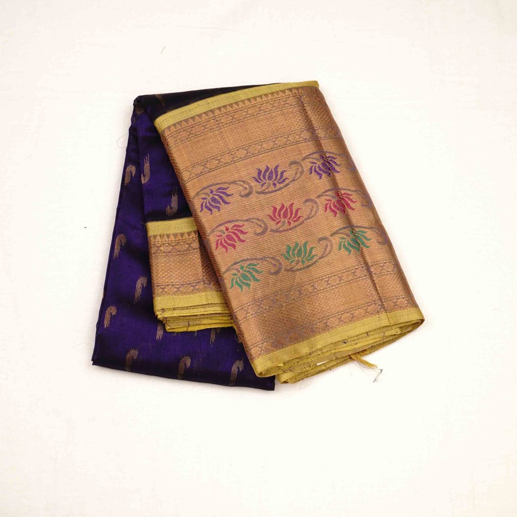 Silk saree in parrot green Kuppadam pattu style, featuring detailed handloom texture and graceful drape ideal for festive and wedding wear