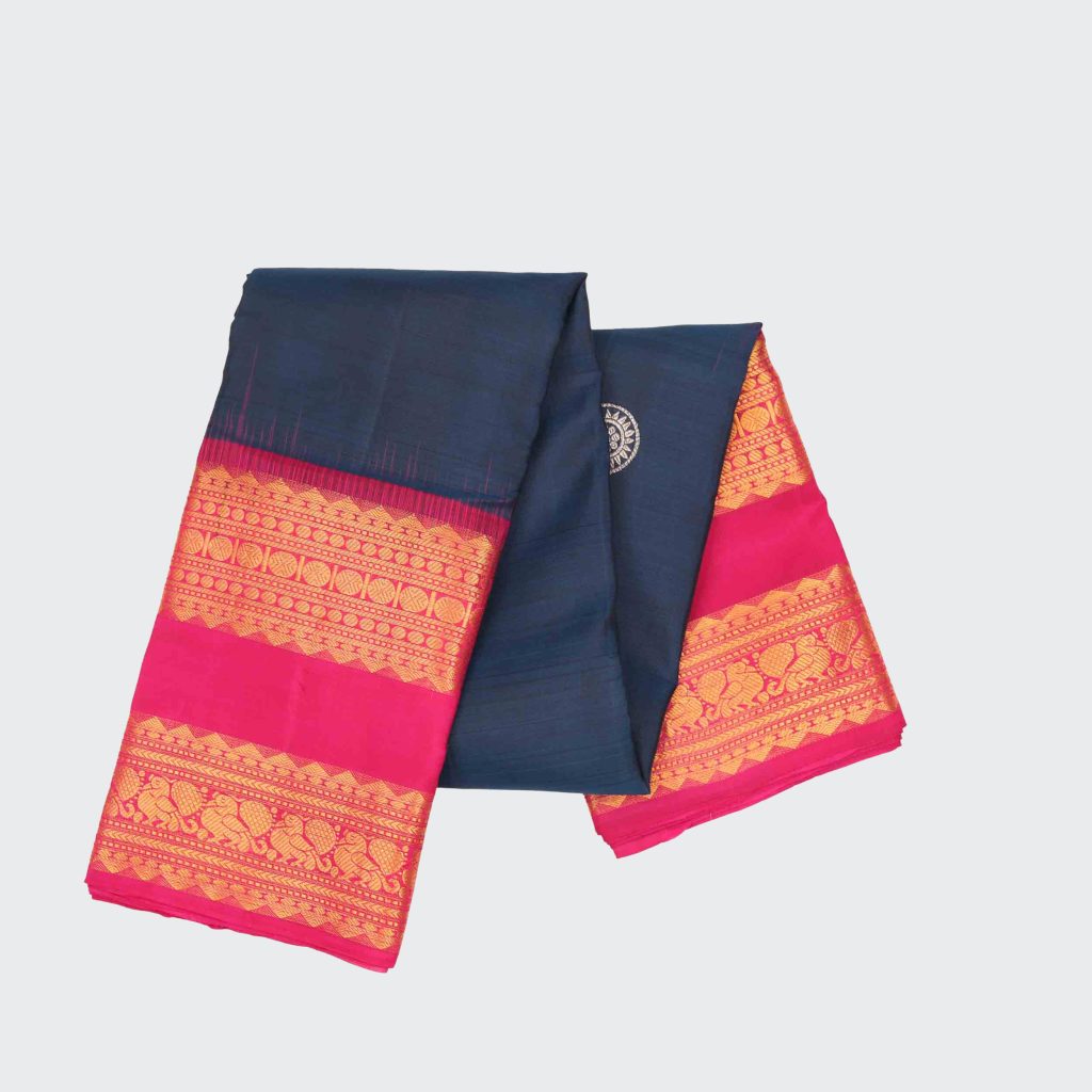 Polynesian blue silk saree featuring traditional Kanchipuram gap border design and detailed handwoven texture for festive and wedding occasions