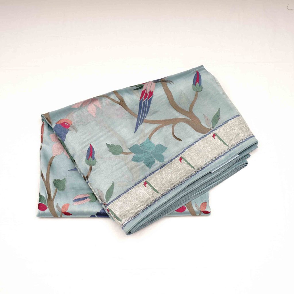 Uranian blue fancy work saree with intricate work displayed on model - designer wedding saree online India