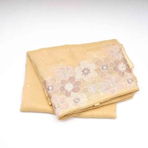 Beautiful yellow and cream colored saree with detailed fancy work perfect for weddings and festive occasions